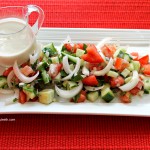 Tomato Cucumber Salad with Onions Parsley and Tahini Dressing