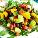 Mango Avocado Salad with Red Pepper Black Beans Cucumber & Lime over Arugula